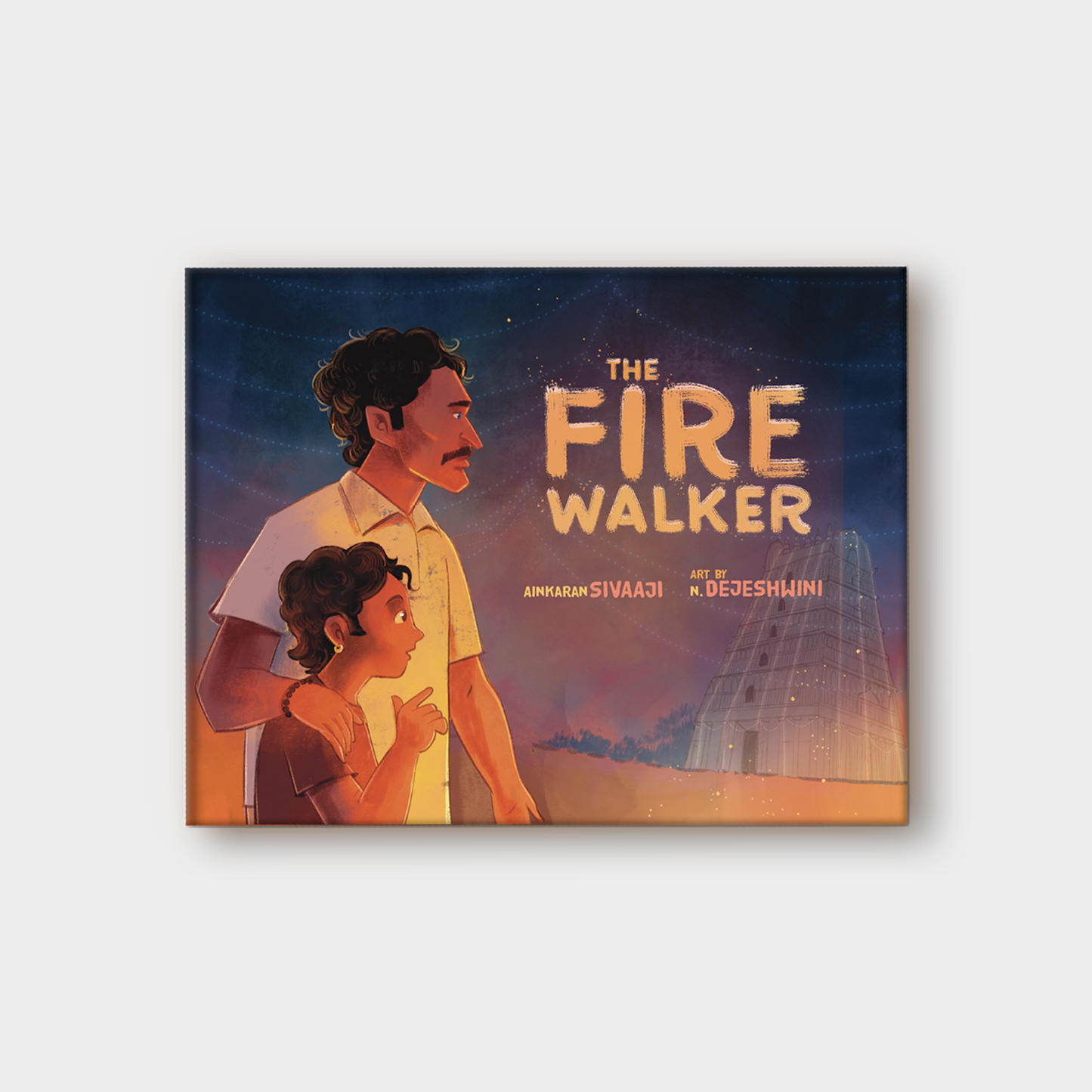 Book cover of 'The Fire Walker' with Appa and Velan standing together with the temple in the background.
